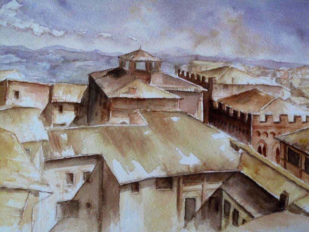Watercolor of terracotta rooftops of an Italian hill town under a hazy sky