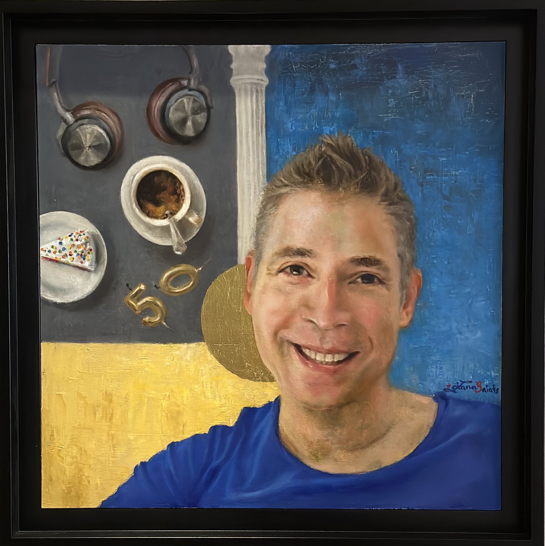 A man's fiftieth birthday portrait, with coffee, cake, and gold candles