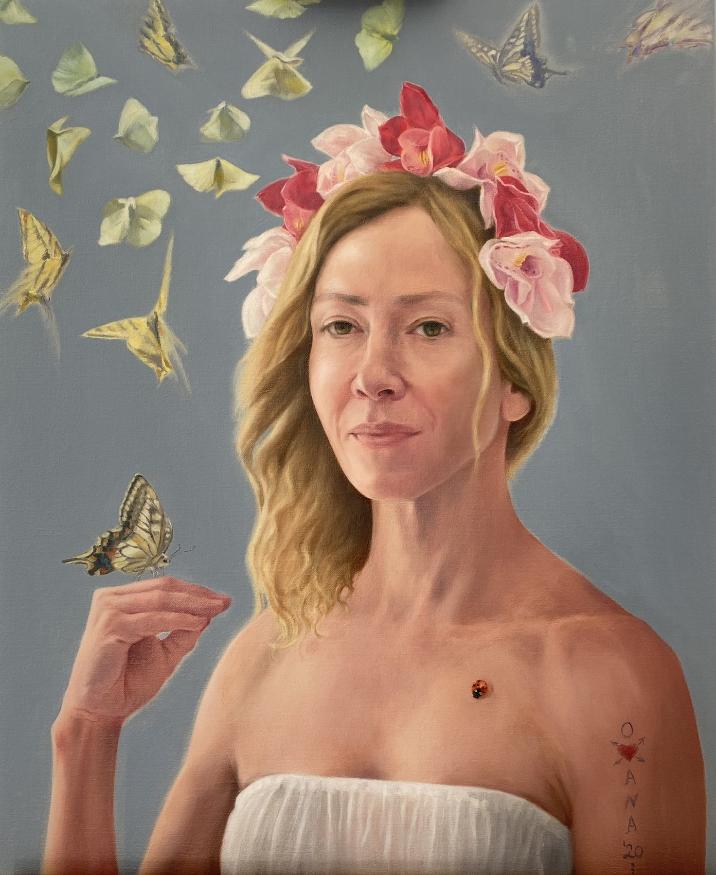 Self-portrait of the artist wearing a crown of flowers, releasing a butterfly from her hand
